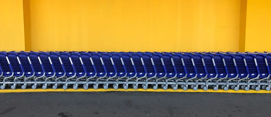 Row of Walmart carts in parking lot