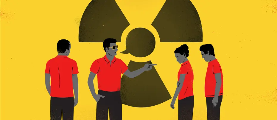 four workers in red shirts and dark pants with a radioactive danger symbol behind them