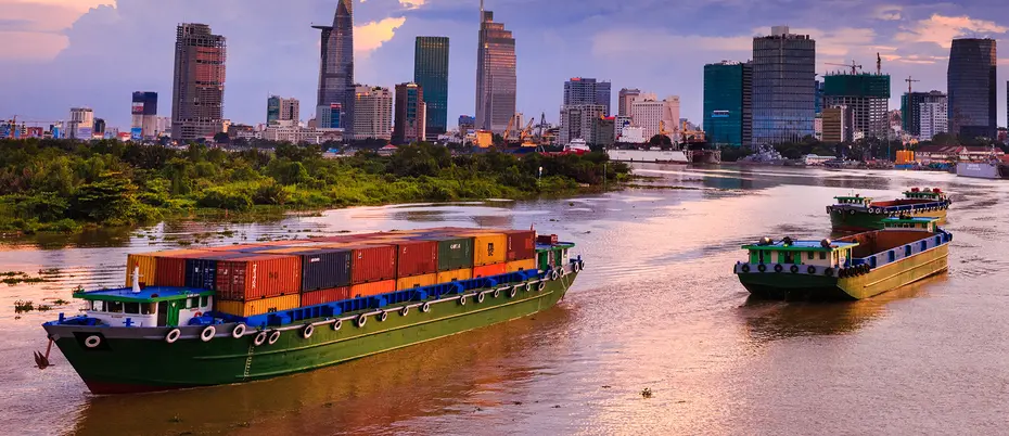 cargo boats and cityscape