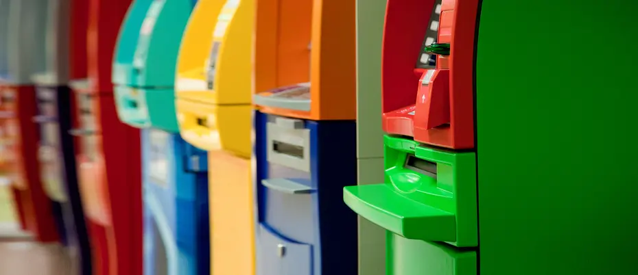 row of ATM machines in bright multicolors
