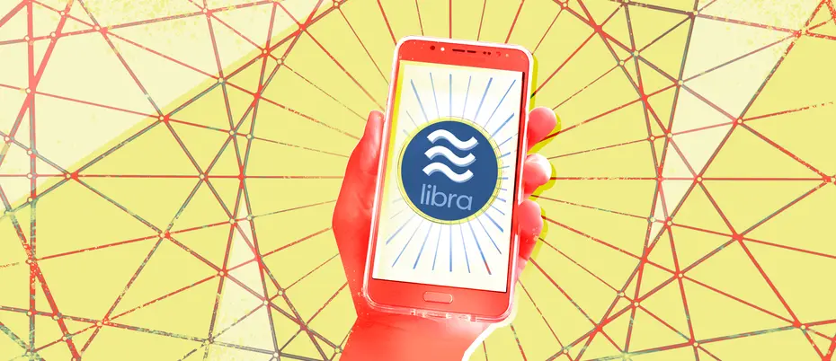 red hand holding a smartphone with Libra logo on its screen