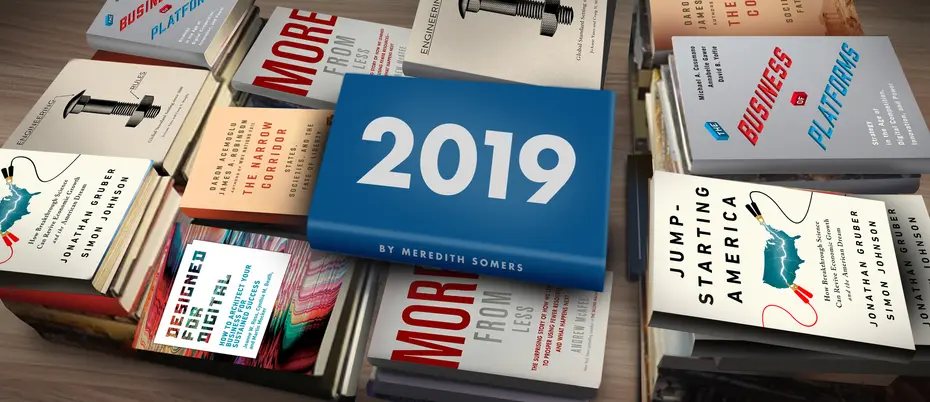 books stacked horizontally on a table