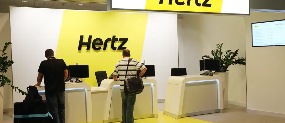 Hertz Car Rental customer kiosk with people 