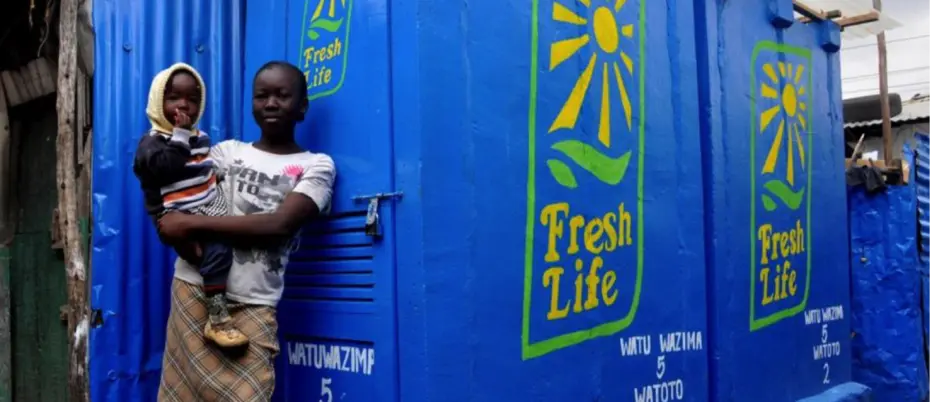 adult and child standing in front of container 