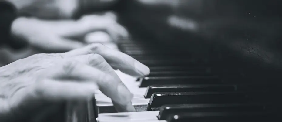 Close up of hands playing the piano. 