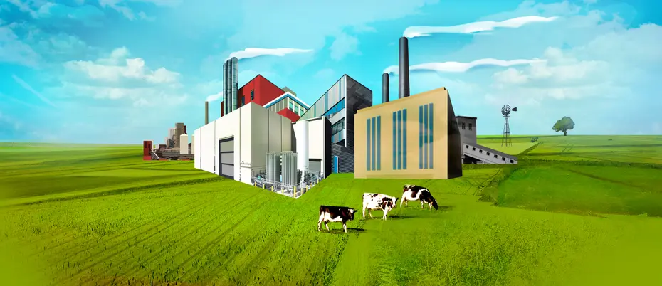 factories on a field of green grass with cows and blue sky overhead
