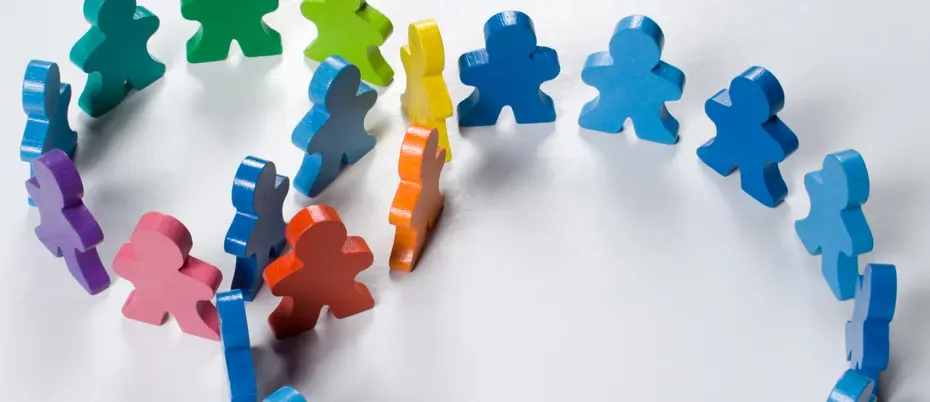 Multicolored wooden people illustrating a business concept - networking or teamwork.