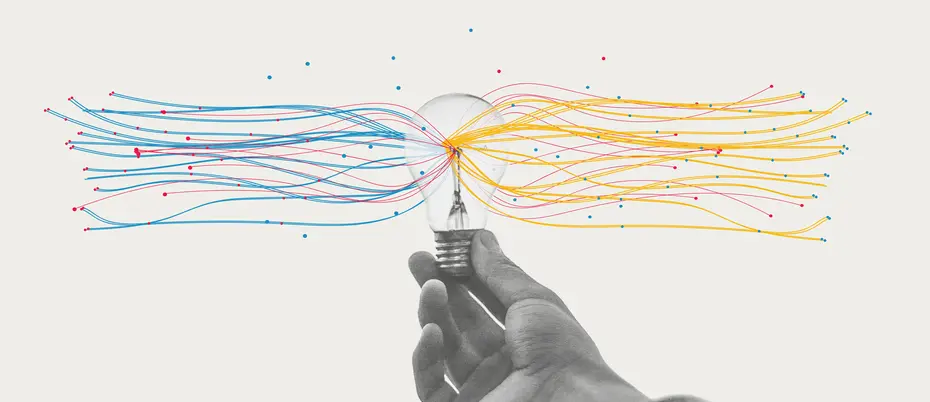 hand holding a lightbulb streaming colored lines representing data analytics