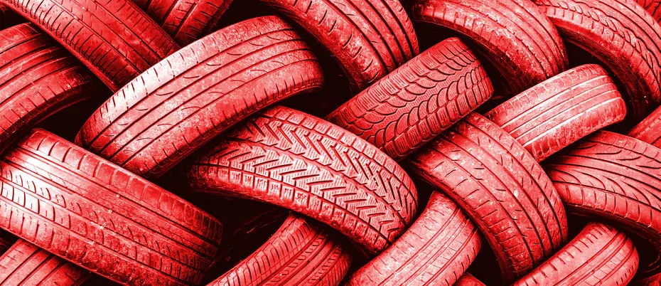 A close-up of a tangle of red tires creating an interesting pattern