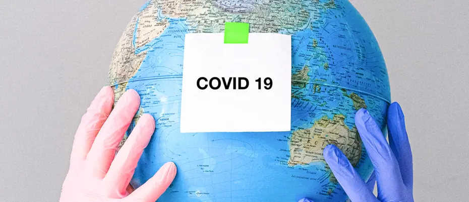 Globe with COVID-19 and medical hands