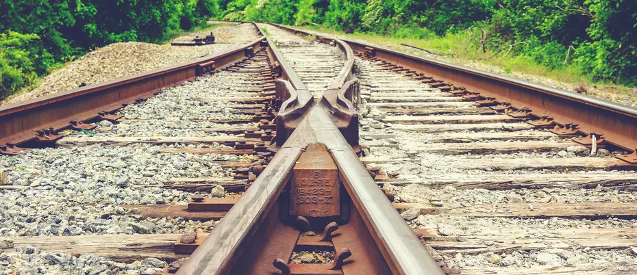 Picture of a train track veering in two directions, to illustrate platform companies taking different paths during the pandemic.