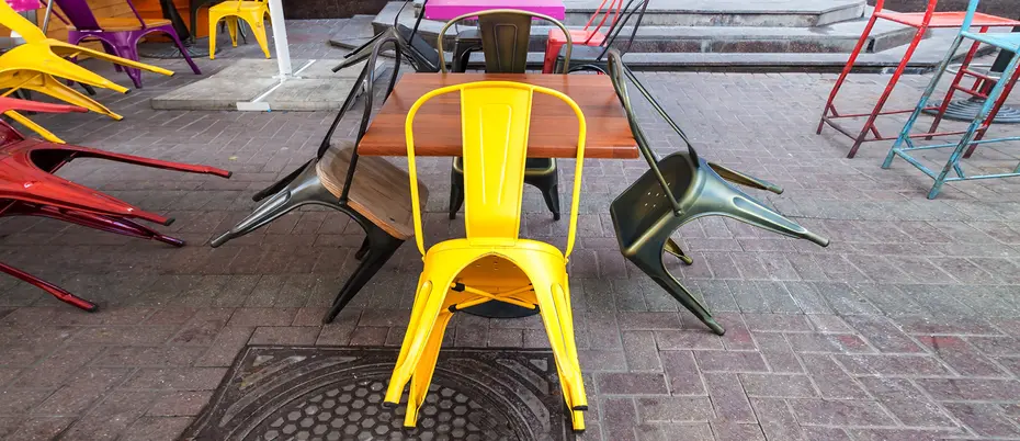 Colorful empty chairs at an outdoor restaurant