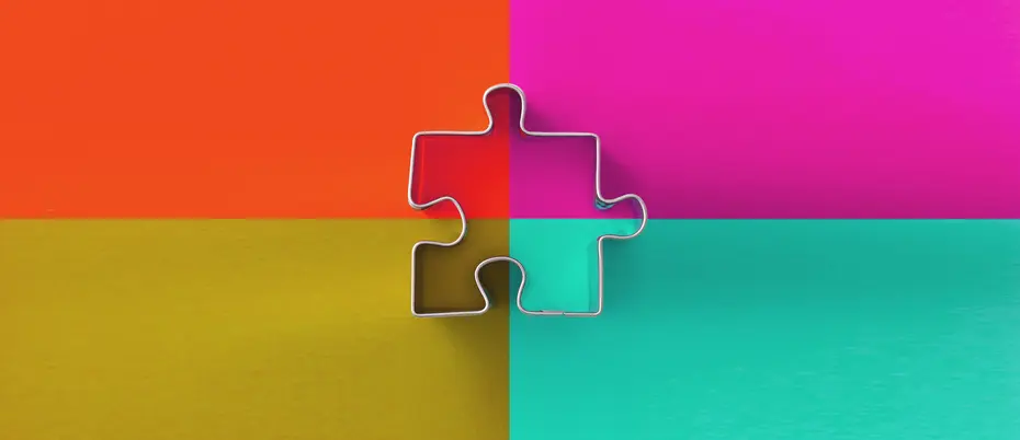 A puzzle piece on top of four quadrants filled with different colors 