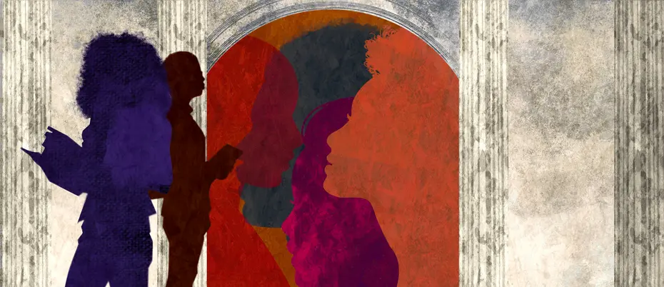 Students standing by a university building door