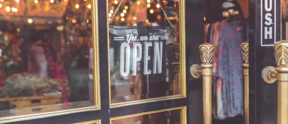 Open sign on clothing store.