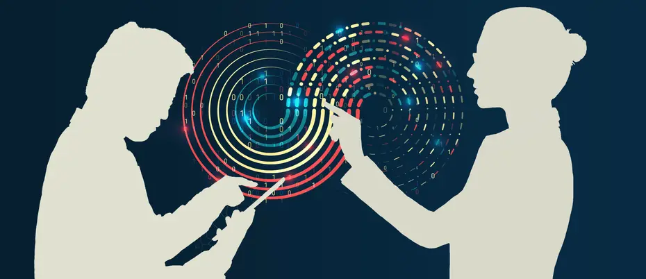 One person examines a machine learning algorithm while another inputs data on a tablet