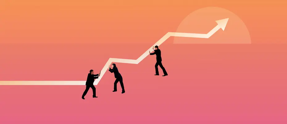 Business people pushing a line graph up towards positive growth