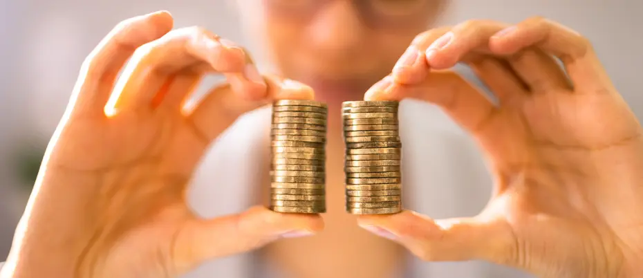 Two hands holding coins