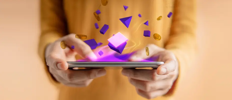 A person holds a tablet with bitcoin, blockchain, and other data shapes coming out of it