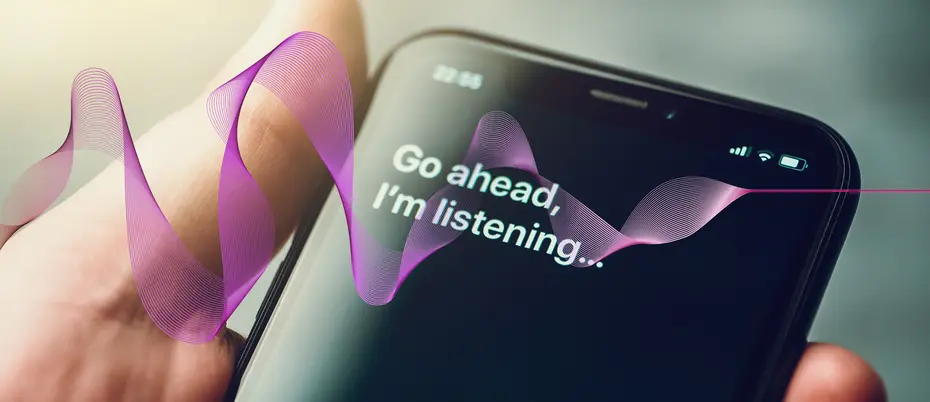 An iphone with Siri's words "Go ahead, I'm listening" on the screen. Graphic AI sound waves move through it. 