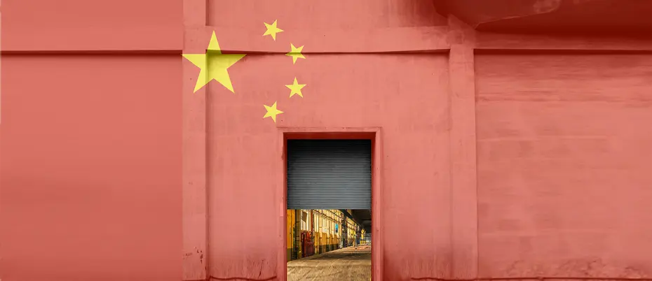 A warehouse painted in the colors of China's flag is half-open