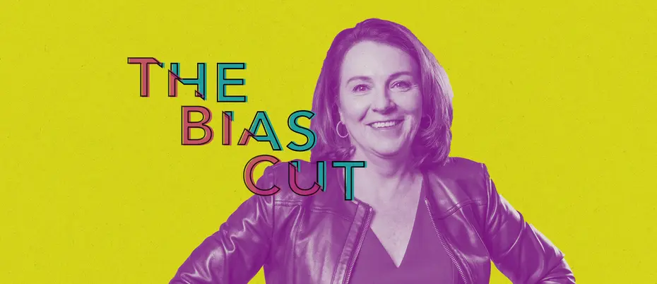 Jackie Yeaney stands with her hands on her hips and smiles. The words "The Bias Cut" descend from left to right across her shoulder.