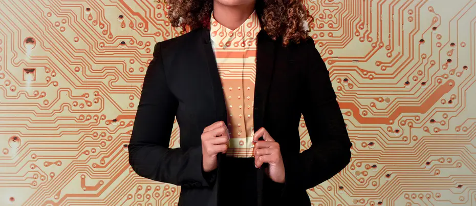 A business person wears a suit with a circuit board pattern