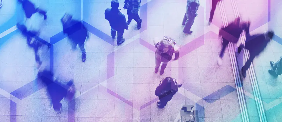 A crowd of workers walking juxtaposed with hexagon shapes