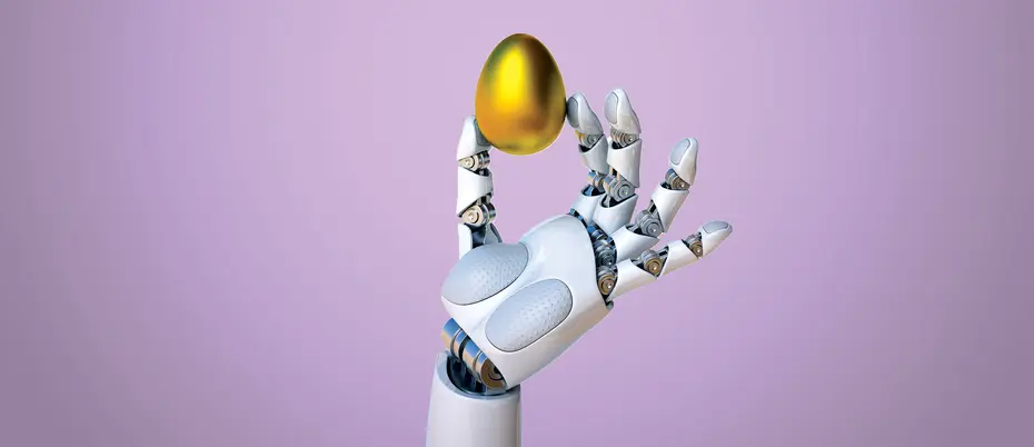 A robot hand holds a golden egg