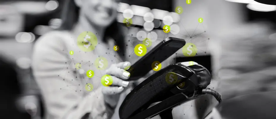 A person uses a mobile device to make a financial transaction