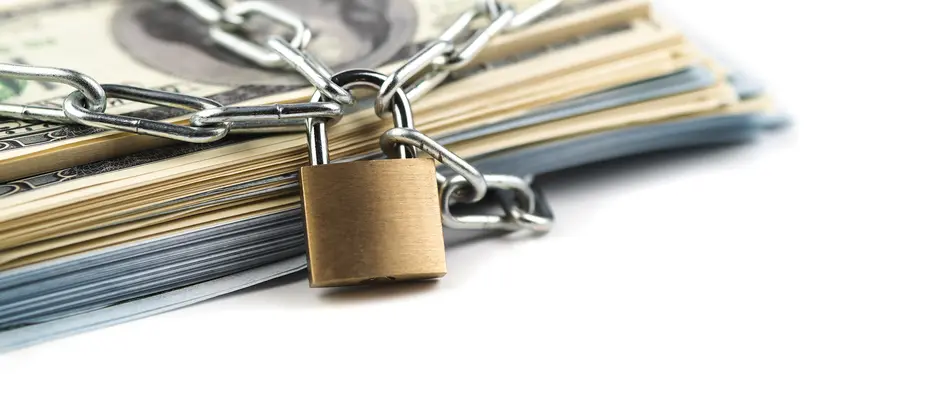 A heap of money  chained up with a locak