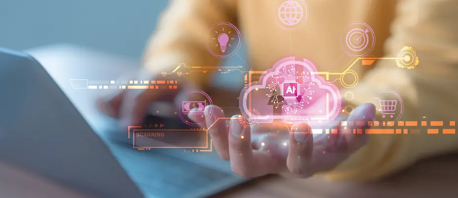 A person works on a laptop with the AI symbol as well as other internet of things graphics