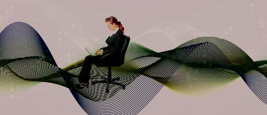 A person working from their laptop surrounded by big data graphics