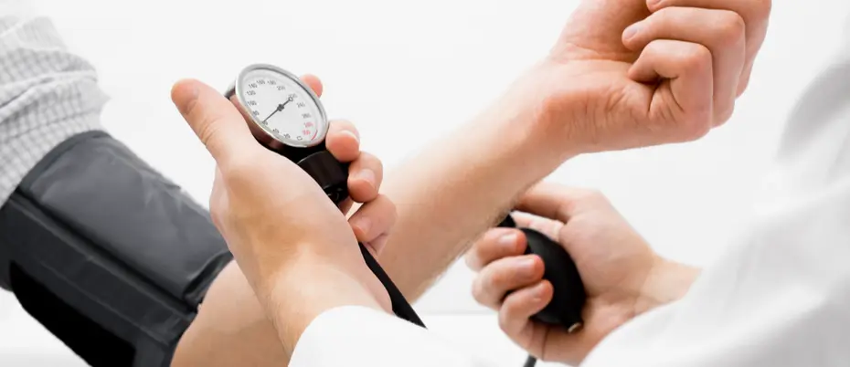 Person's arm having their blood pressure taken