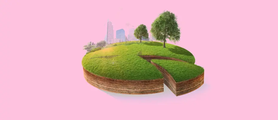 A pie chart resembling a piece of green land with a city skyline and trees 