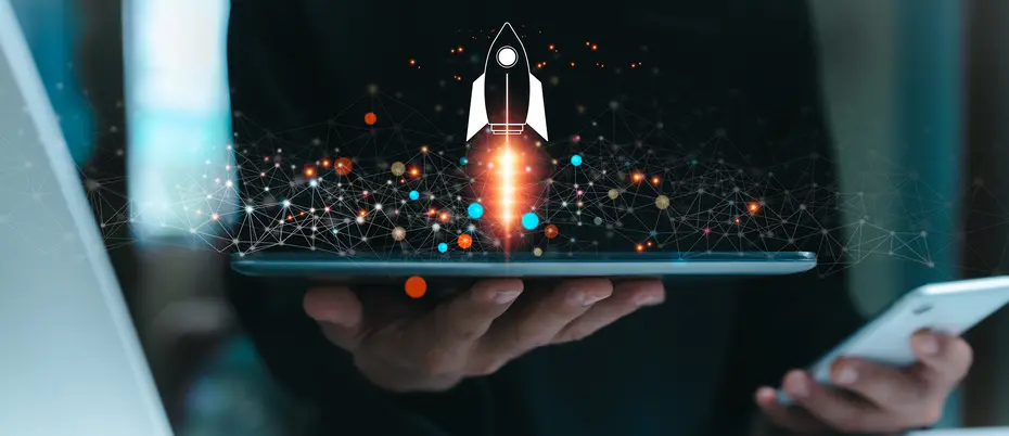 A business person uses a tablet is shown with a rocket symbol blasting off and shooting out of the screen with ai imagery