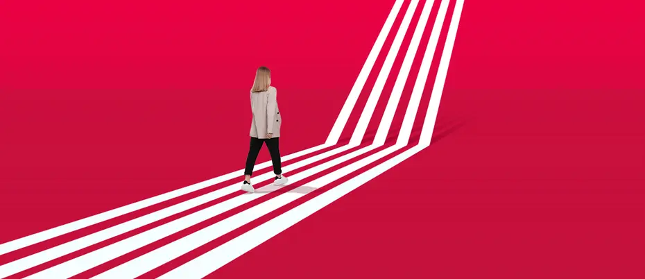 A person walks on a path that becomes a ladder