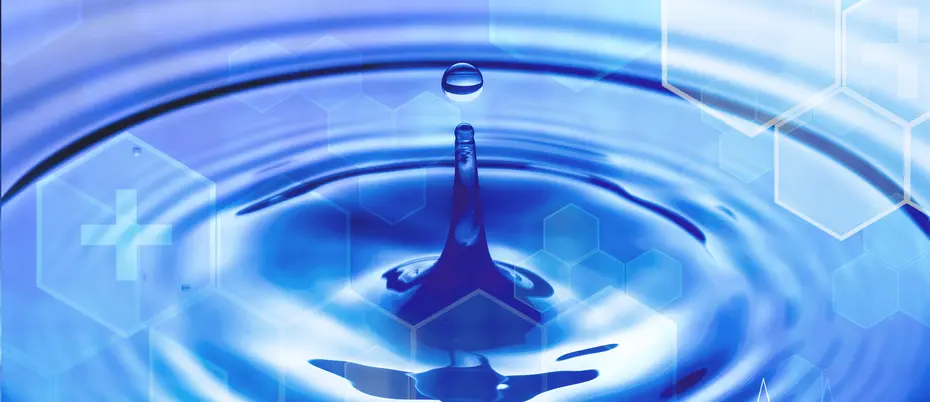 A water droplet creates a ripple with a medical hexagon pattern juxtaposed on top