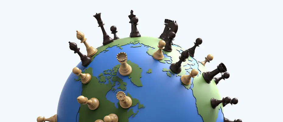 The world globe covered in chess pieces