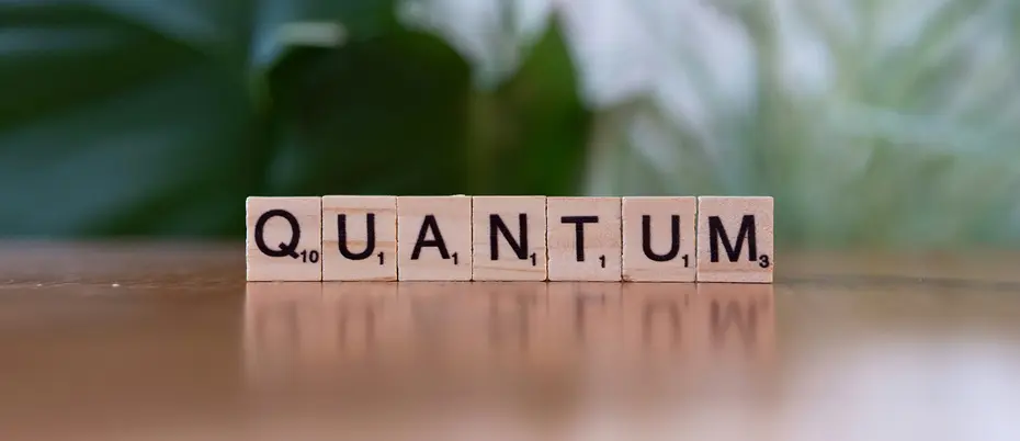Scrabble pieces spell out the word "Quantum"