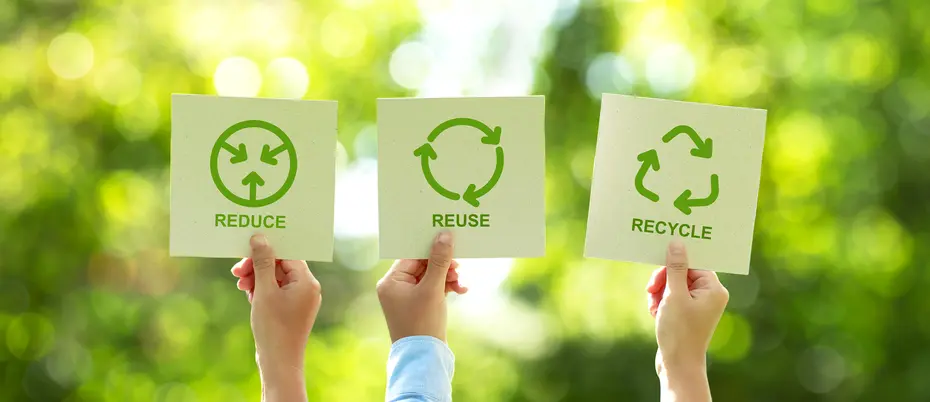 People holding recycling signs
