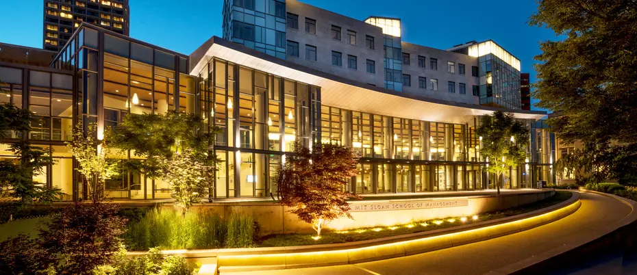 River side of MIT Sloan Building E62 at dusk