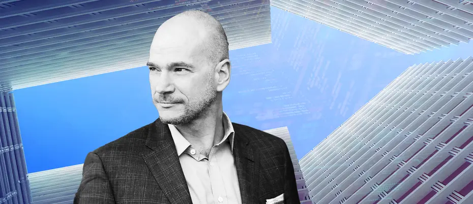 Andrew McAfee and buildings forming an arrow with code