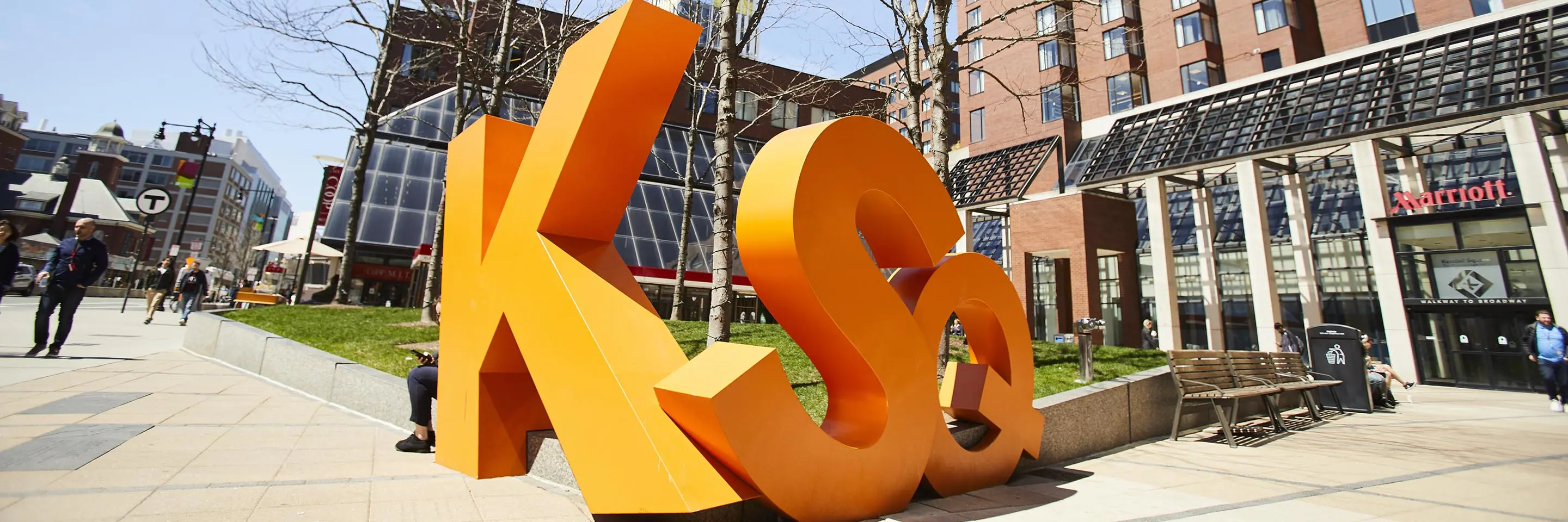 A sculpture of Kendall Square's initials in front of the Boston Marriott Cambridge.