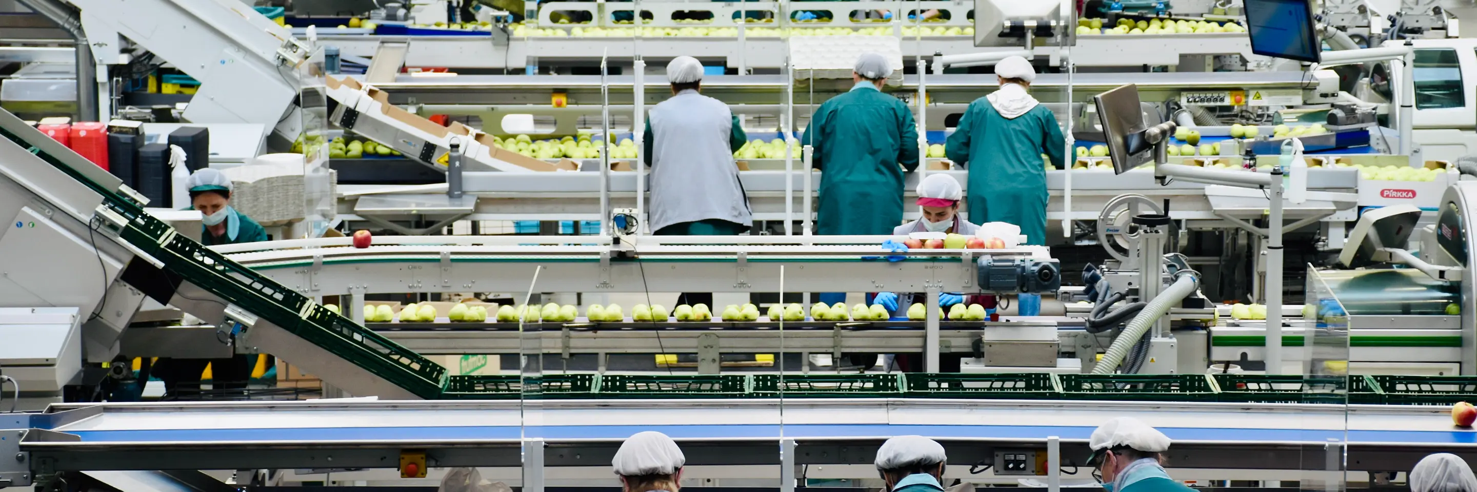 Assembly line workers in an European workplace