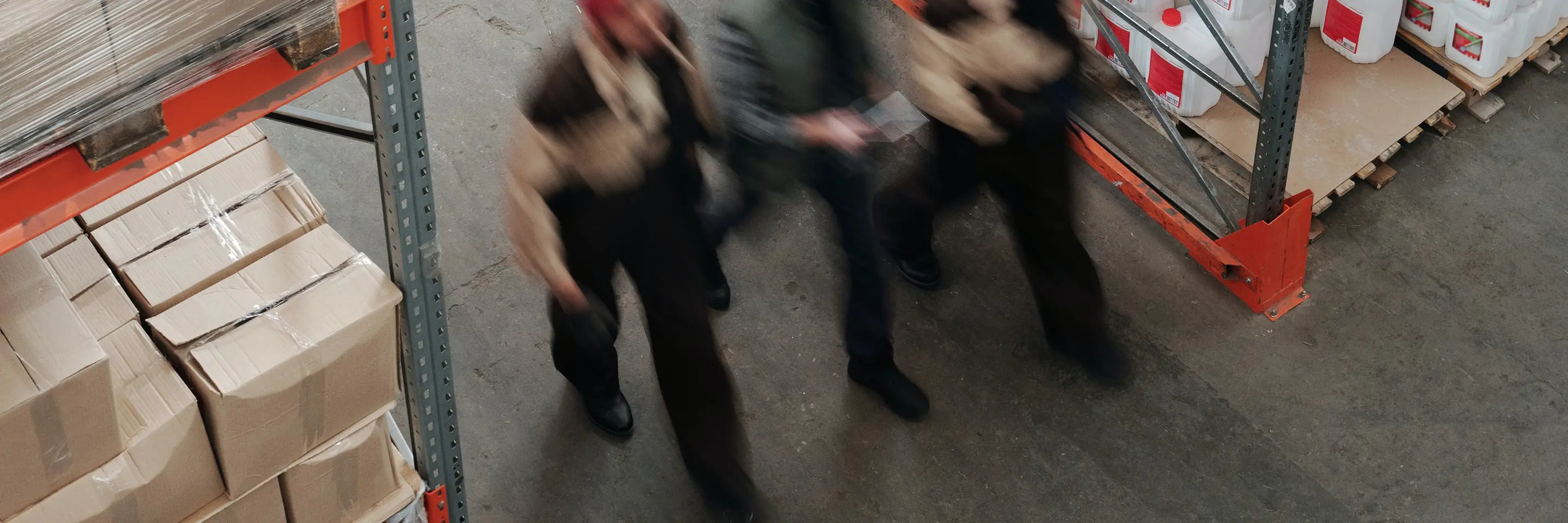 Workers walking through warehouse