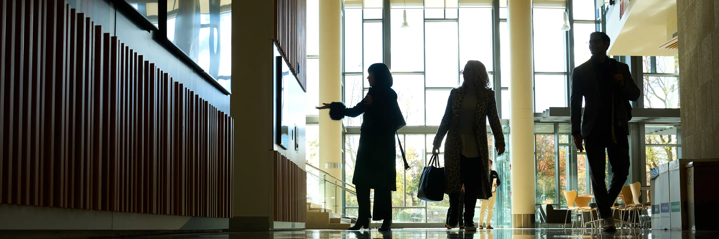 People walk the halls of E62.