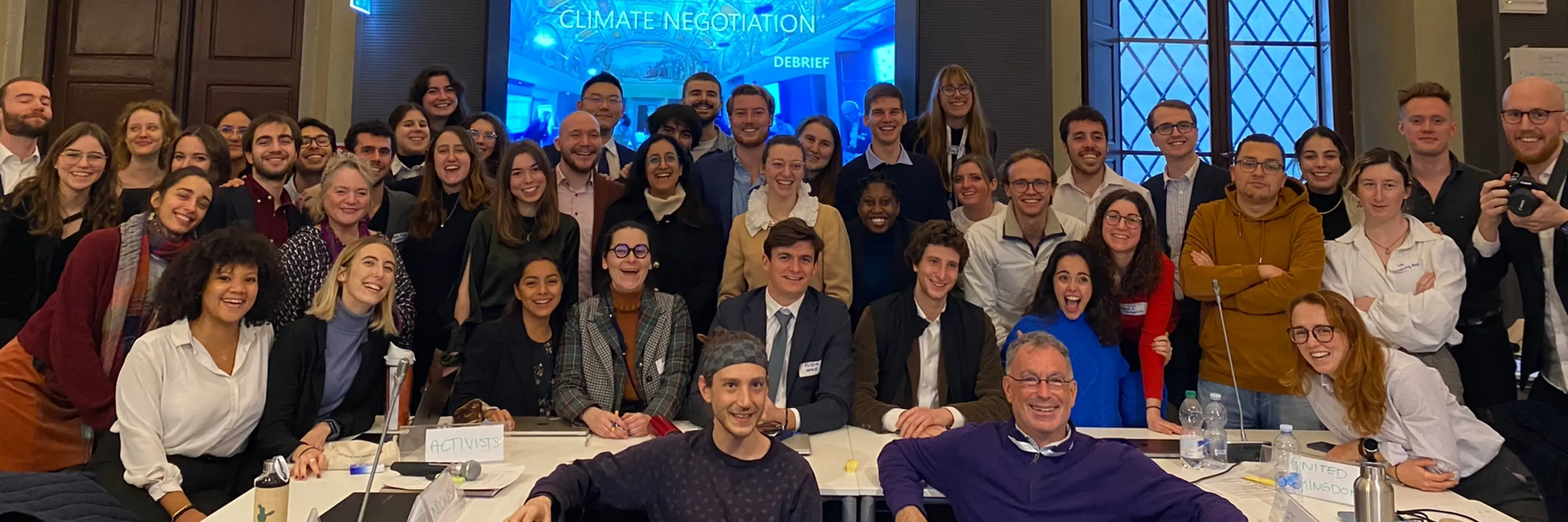 Participants in Responsible Negotiations Across Borders celebrate a climate negotiation success. Photo Credit: EUI STG