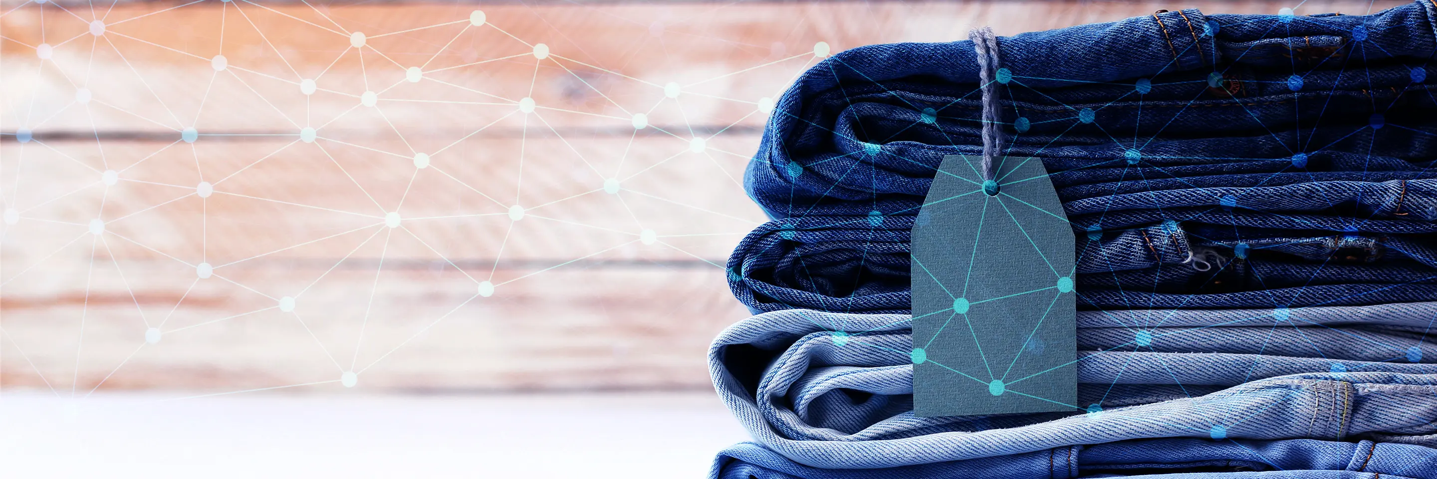 A stack of jeans with network/AI imagery overlayed on top