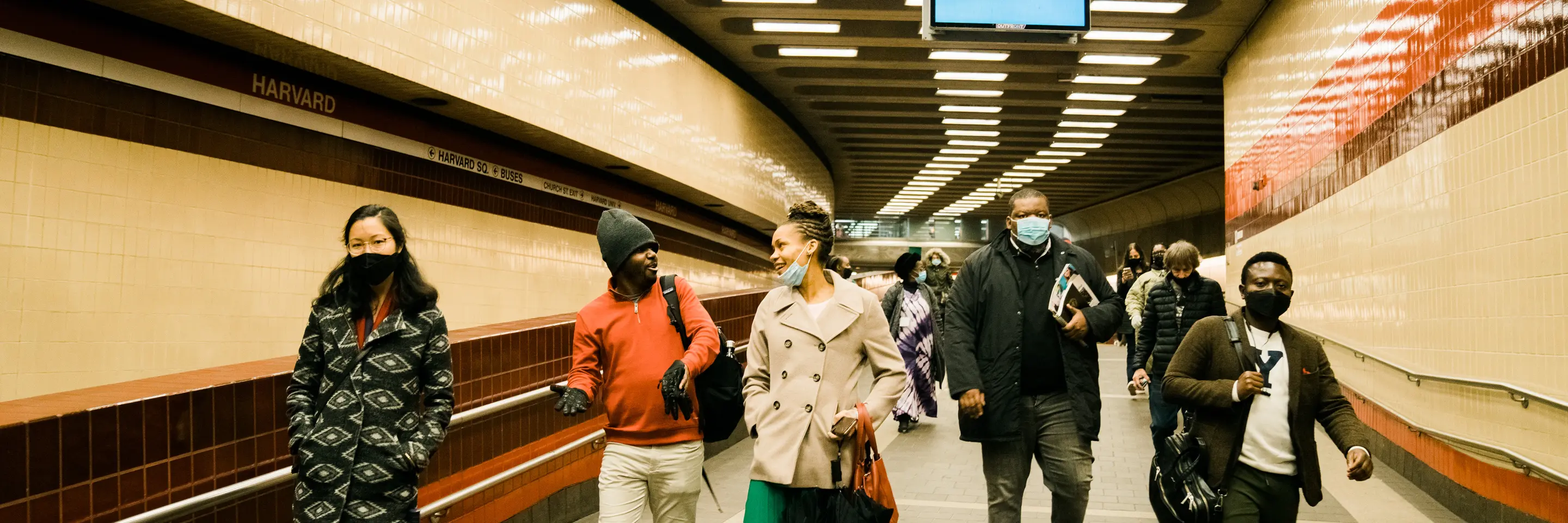 Five people walking through an airport